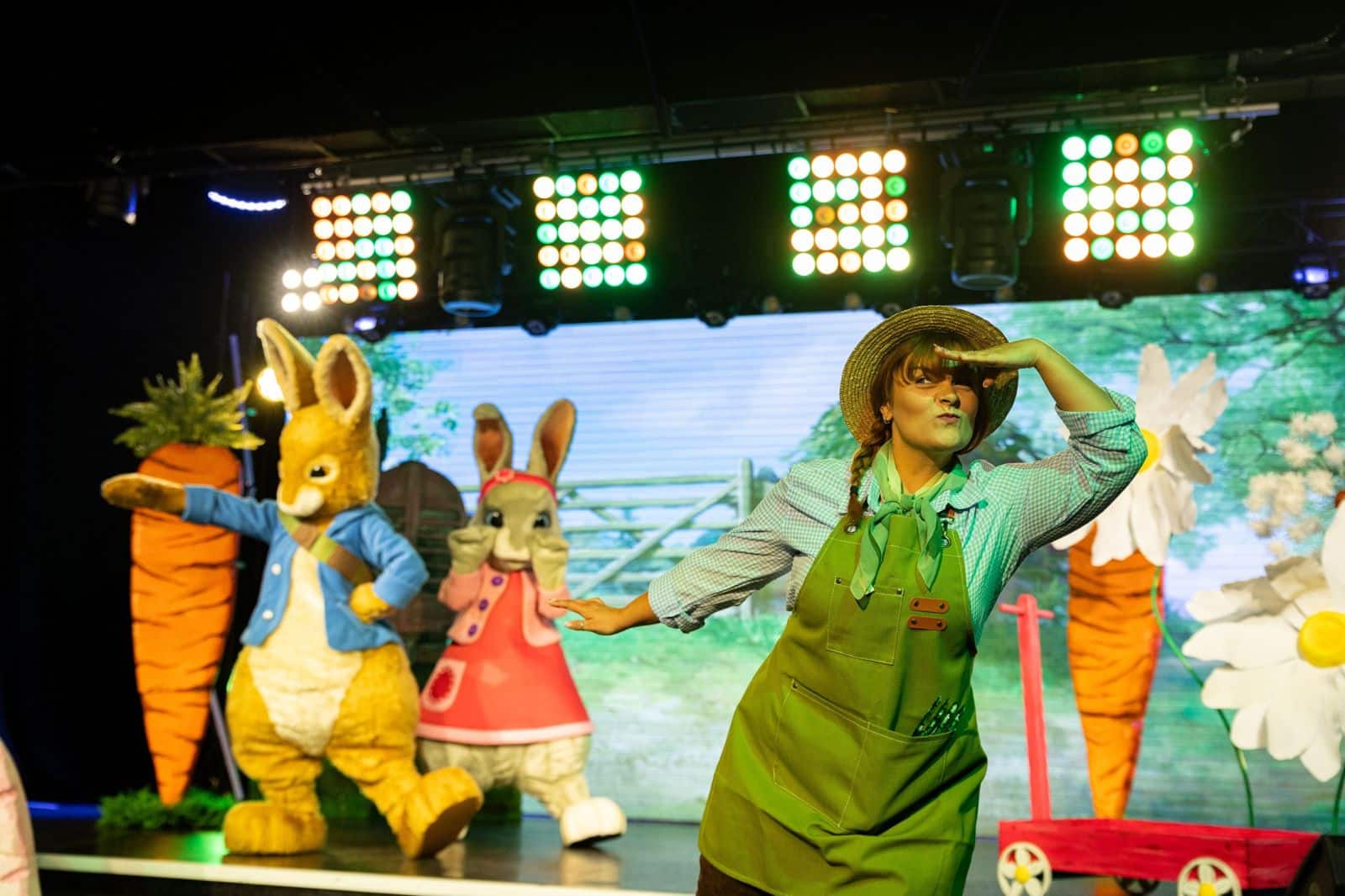 Gardener on stage with Peter Rabbit and Lily in Peter Rabbit 'In The Garden' family show