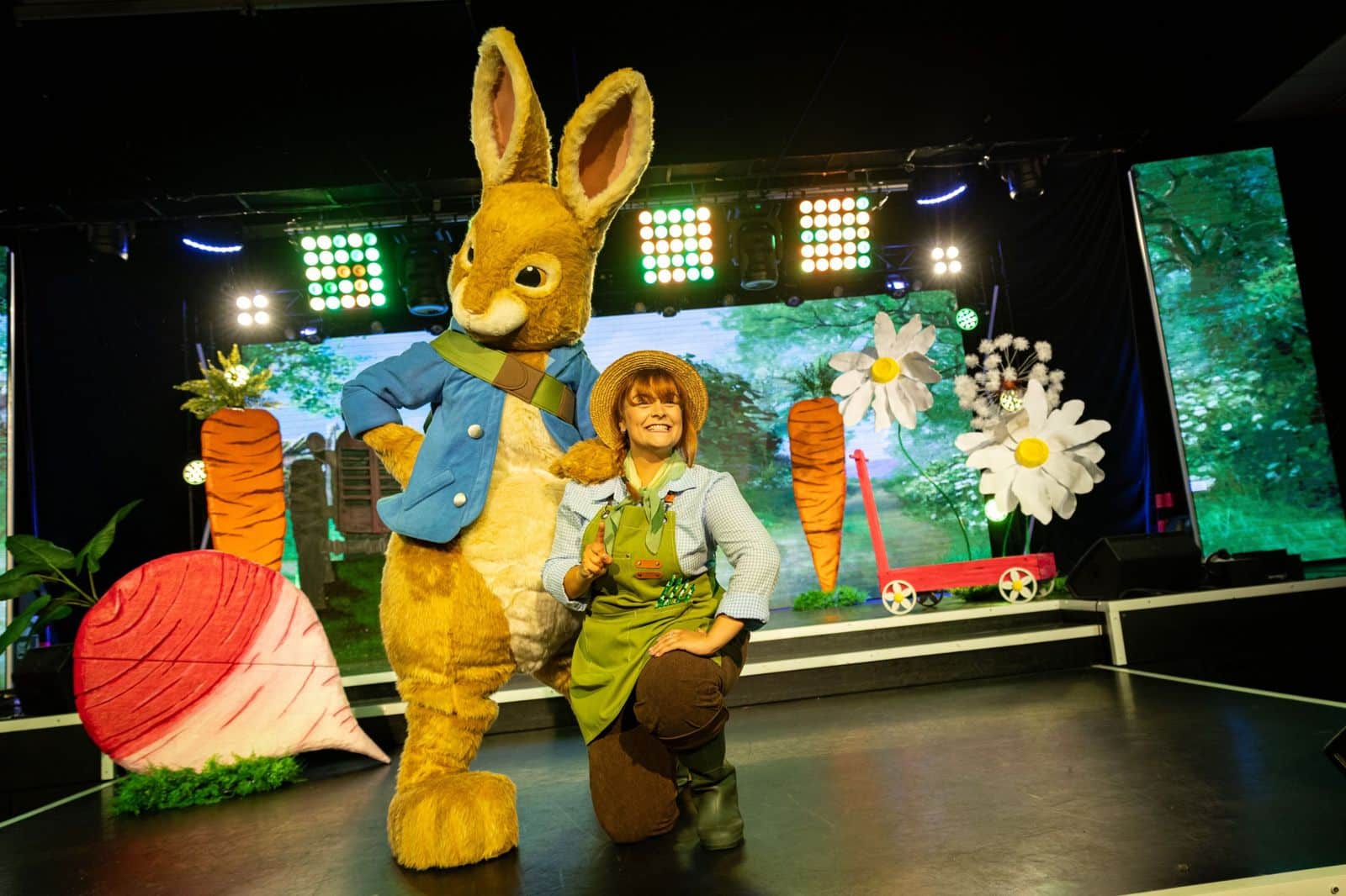 Peter Rabbit with the gardener on stage in Peter Rabbit 'In The Garden' live show