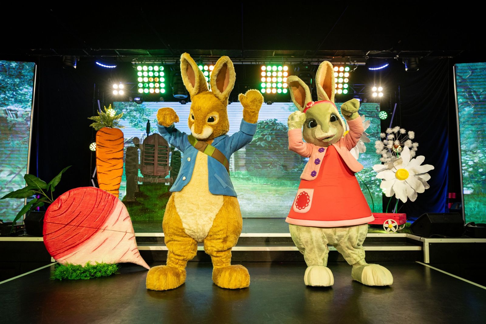 Peter Rabbit and Lily waving on stage at Peter Rabbit 'In The Garden' live show